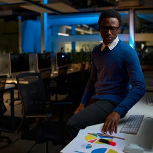 man in glasses works on computer, office lifestyle
